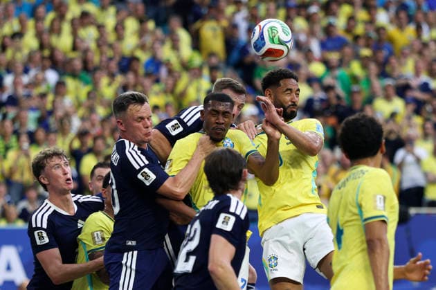 (260625) -- MIAMI, June 25, 2026 -- Players fight for a headball during the group C match between Scotland and Brazil at the 2026 FIFA World Cup, WM, Weltmeisterschaft, Fussball at Miami Stadium, Miami, the United States, June 24, 2026. ) (SP)U.S.-MIAMI-FOOTBALL-FIFA WORLD CUP-GROUP C-SCO VS BRA XuxZijian 