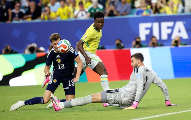 (260625) -- MIAMI, June 25, 2026 -- Angus Gunn (R), goalkeeper of Scotland, tries to save the ball during the group C match between Scotland and Brazil at the 2026 FIFA World Cup, WM, Weltmeisterschaft, Fussball at Miami Stadium, Miami, the United States, June 24, 2026. ) (SP)U.S.-MIAMI-FOOTBALL-FIFA WORLD CUP-GROUP C-SCO VS BRA ZhangxChen 