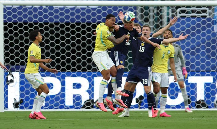 (260625) -- MIAMI, June 25, 2026 -- Players fight for a headball during the group C match between Scotland and Brazil at the 2026 FIFA World Cup, WM, Weltmeisterschaft, Fussball at Miami Stadium, Miami, the United States, June 24, 2026. ) (SP)U.S.-MIAMI-FOOTBALL-FIFA WORLD CUP-GROUP C-SCO VS BRA ZhangxChen 