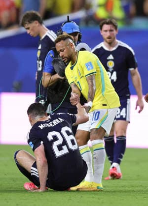 (260625) -- MIAMI, June 25, 2026 -- Neymar (R, front) of Brazil pulls up Scott McKenna (L, front) of Scotland after the group C match between Scotland and Brazil at the 2026 FIFA World Cup, WM, Weltmeisterschaft, Fussball at Miami Stadium, Miami, the United States, June 24, 2026. ) (SP)U.S.-MIAMI-FOOTBALL-FIFA WORLD CUP-GROUP C-SCO VS BRA ZhangxChen 