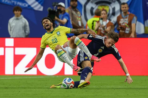 MIAMI GARDENS, FL - JUNE 24: Lucas Paqueta 20 of Brazil and Scott McTominay 4 of Scotland battle for the ball during a FIFA World Cup, WM, Weltmeisterschaft, Fussball 2026 Group C match between Scotland and Brazil on June 24,2026 at Miami Stadium, in Miami Gardens, Fla.(Photo by Chris Arjoon Icon Sportswire) SOCCER: JUN 24 FIFA World Cup 26 Group C - Scotland vs Brazil EDITORIAL USE ONLY Icon26062400100025