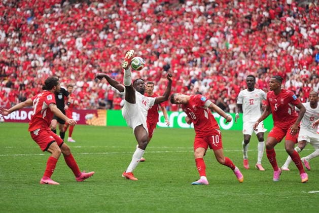 June 24, 2026, Vancouver, Bc, CANADA: Canada s Promise David (24) takes a shot on goal as Switzerland s Granit Xhaka (10) defends during the second half of a World Cup Group B soccer match, in Vancouver, on Wednesday, June 24, 2026. Canada News - June 24, 2026  - ZUMAc35_ 20260624_zaf_c35_233 Copyright: xDarrylxDyckx