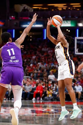 INDIANAPOLIS, IN - JUNE 24: Indiana Fever guard Kelsey Mitchell (0) knocks down her three pointer over Phoenix Mercury forward Valeriane Ayayi (11) in the second half of play during a WNBA, Basketball Damen, USA game between the Phoenix Mercury and the Indiana Fever on June 24, 2026 at Gainbridge Fieldhouse in Indianapolis, IN. (Photo by Jeffrey Brown Icon Sportswire) WNBA: JUN 24 Phoenix Mercury at Indiana Fever EDITORIAL USE ONLY Icon002626017