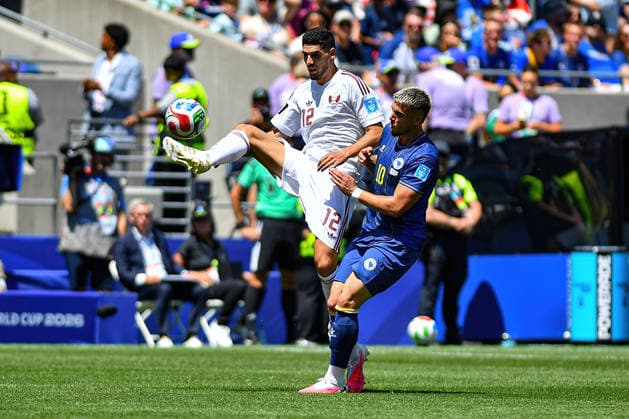 June 24, 2026: Qatar midfielder Karim Boudiaf (12) makes airborne contact with the ball past Bosnia and Herzegovina forward Ermedin DemiroviÄ¡ (10) during the FIFA World Cup, WM, Weltmeisterschaft, Fussball match between Bosnia - Herzegovina and Qatar in Seattle, WA.Bosnia - Herzegovina defeated Qatar 3-1. CSM FIFA World Cup 2026: JUN 24 Bosnia - Herzegovina Vs Qatar  - ZUMAc04_ 20260624_zma_c04_044 Copyright: xStevexFaberx