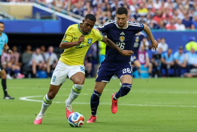 MIAMI GARDENS, FL - JUNE 24: Rayan 26 of Brazil and Scott McKenna 26 of Scotland battle for a ball during a FIFA World Cup, WM, Weltmeisterschaft, Fussball 2026 Group C match between Scotland and Brazil on June 24,2026 at Miami Stadium, in Miami Gardens, Fla.(Photo by Chris Arjoon Icon Sportswire) SOCCER: JUN 24 FIFA World Cup 26 Group C - Scotland vs Brazil EDITORIAL USE ONLY Icon26062400100053