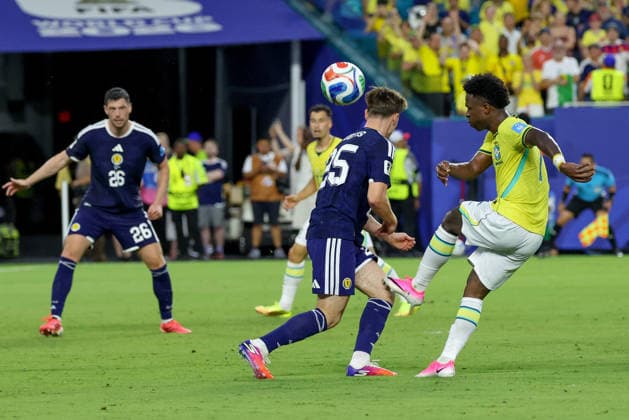 MIAMI GARDENS, FL - JUNE 24: Vinicius Junior 7 of Brazil shoots on goal as Findlay Curtis 25 of Scotland attempts to block during a FIFA World Cup, WM, Weltmeisterschaft, Fussball 2026 Group C match between Scotland and Brazil on June 24,2026 at Miami Stadium, in Miami Gardens, Fla.(Photo by Chris Arjoon Icon Sportswire) SOCCER: JUN 24 FIFA World Cup 26 Group C - Scotland vs Brazil EDITORIAL USE ONLY Icon26062400100061