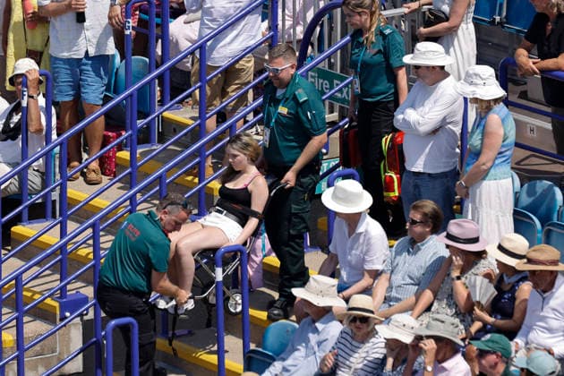 RECORD DATE NOT STATED 25th June 2026; Devonshire Park Lawn Tennis Club, Eastbourne, East Sussex, England; Lexus Eastbourne Open Tennis, Day Five; A Spectator lift by the paramedics during to the hot weather at Centre Court HongboxChen