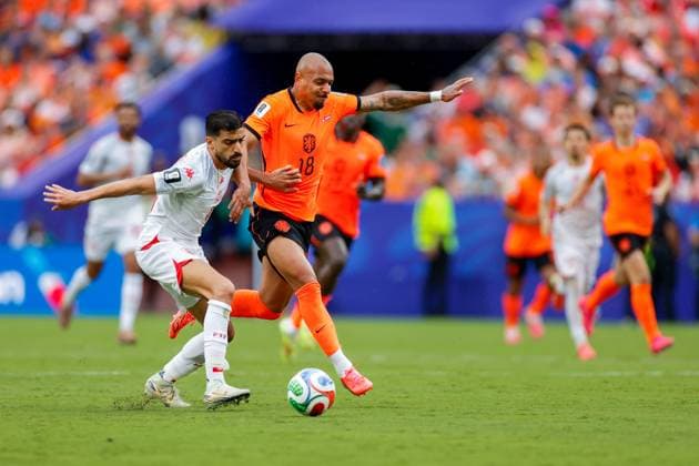 KANSAS CITY, 25-06-2026, Kansas City Stadium, World Cup 2026 Match between Tunesia and The Netherlands. Picture Shows Tunisia player Mohamed Amine Ben Hmida and Netherlands player Donyell Malen Tunesia - Netherlands (World Cup 2026)  x204647686x Copyright: