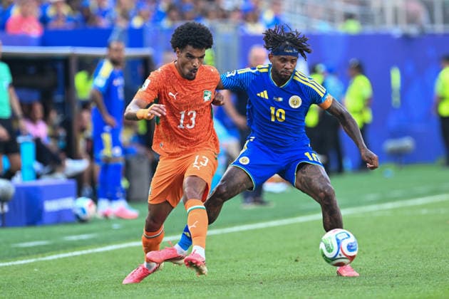 PHILADELPHIA, PA - JUNE 25: Christopher Operi 13 of Cote d Ivoire and Leandro Bacuna 10 of Curacao battle for the ball during the FIFA World Cup, WM, Weltmeisterschaft, Fussball 2026 Group E match between Curacao and Cote d™Ivoire on June 25th, 2026 at Philadelphia Stadium in Philadelphia, PA.(Photo by Terence Lewis Icon Sportswire) SOCCER: JUN 25 FIFA World Cup 26 Group E - Curacao vs Cote d Ivoire EDITORIAL USE ONLY Icon260625046