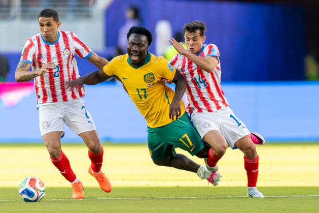 SANTA CLARA, CA - JUNE 25: Nestory Irankunda 17 of Australia is fouled by Andres Cubas 14 of Paraguay during the FIFA World Cup, WM, Weltmeisterschaft, Fussball Group D match between Paraguay and Australia on June 25, 2026 at San Francisco Bay Area Stadium in Santa Clara, CA. (Photo by Bob Kupbens Icon Sportswire) SOCCER: JUN 25 FIFA World Cup 26 Group D - Paraguay vs Australia EDITORIAL USE ONLY Icon260625016
