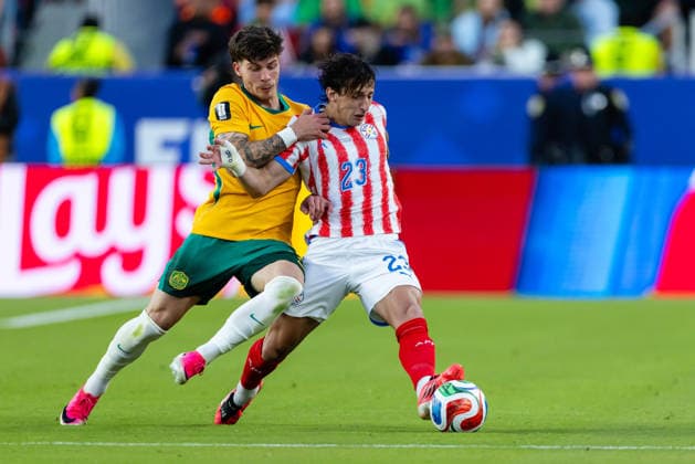 SANTA CLARA, CA - JUNE 25: Jordan Bos 5 of Australia and Matias Galarza 23 of Paraguay battle for the ball during the FIFA World Cup, WM, Weltmeisterschaft, Fussball 2026 Group D match between Paraguay and Australia on June 25, 2026 at San Francisco Bay Area Stadium in Santa Clara, CA. (Photo by Matthew Huang Icon Sportswire) SOCCER: JUN 25 FIFA World Cup 26 Group D - Paraguay vs Australia EDITORIAL USE ONLY Icon260625011