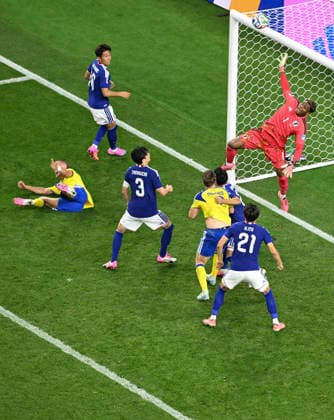 (260626) -- DALLAS, June 26, 2026 -- Suzuki Zion (1st R), goalkeeper of Japan, jumps to save the ball during the group F match between Japan and Sweden at the 2026 FIFA World Cup, WM, Weltmeisterschaft, Fussball at Dallas Stadium in Dallas, the United States, on June 25, 2026. ) (SP)U.S.-DALLAS-FOOTBALL-FIFA WORLD CUP-GROUP F-JPN VS SWE ChengxMin 