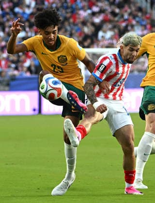 (260626) -- SAN FRANCISCO, June 26, 2026 -- Lucas Herrington (L) of Australia vies with Julio Enciso of Paraguay during the group D match between Paraguay and Australia at the 2026 FIFA World Cup, WM, Weltmeisterschaft, Fussball at San Francisco Bay Area Stadium in San Francisco, the United States, June 25, 2026. (Photo by Xinhua) (SP)U.S.-SAN FRANCISCO-FOOTBALL-FIFA WORLD CUP-GROUP D-PRY VS AUS ZiyuxJulianxZhu 