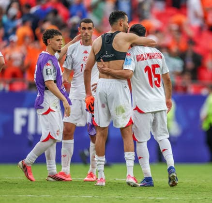 JUNE 25, 2026: Tunisia midfielder Mohamed Hadj Mahmoud (15) gets consoled by Tunisia forward Hazem Mastouri (9) after the match at Kansas City Stadium in Kansas City, MO. CSM Kansas City United States - ZUMAc04_ 20260625_zma_c04_405 Copyright: xRomanxPunox