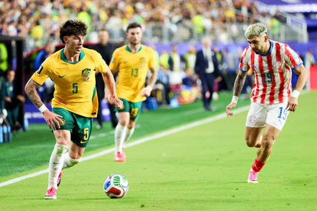 June 25, 2026, Santa Clara, California, USA: Santa Clara, USA - June 25 2026: Jordan Bos 5 of Australia and Julio Enciso 19 of Paraguay compete during a FIFA World Cup, WM, Weltmeisterschaft, Fussball group match between Paraguay and Australia at San Francisco Bay Area Stadium World Cup 2026: Group D: Paraguay 0:0 Australia  - ZUMAp121 20260625_zsp_p121_054 Copyright: xChrisxPutnamx