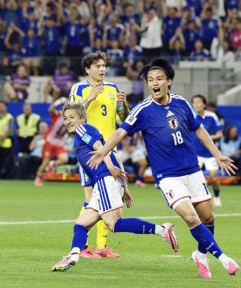 Football: 2026 World Cup Japan s Daizen Maeda (L) celebrates scoring the opening goal in the second half of a World Cup Group F football match against Sweden at Dallas Stadium in Arlington, Texas, on June 25, 2026.  A14AA0005620255P