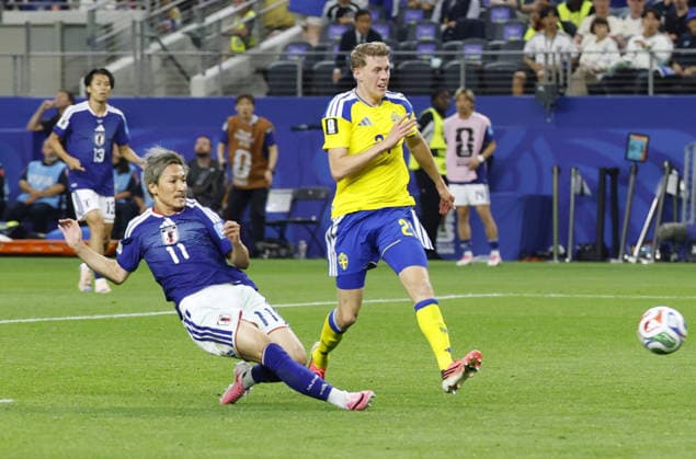 Football: 2026 World Cup Japan s Daizen Maeda (L) scores the opening goal in the second half of a World Cup Group F football match against Sweden at Dallas Stadium in Arlington, Texas, on June 25, 2026.  A14AA0005620259P