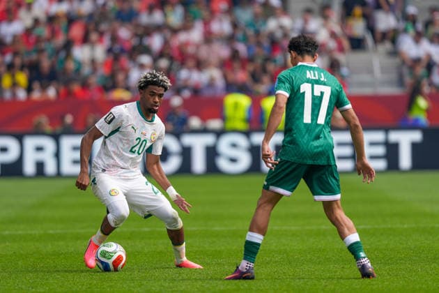Senegal v Iraq - FIFA World Cup, WM, Weltmeisterschaft, Fussball 2026 - Group I TORONTO, CANADA - JUNE 26: Ibrahim Mbaye (20) of Senegal in action againstAli Jasim (17) of Iraq during the 2026 FIFA World Cup First Stage Group I match between Senegal and Iraq at Toronto Stadium (BMO Field) in Toronto, Ontario, Canada on June 26, 2026. Mert Alper Dervis Anadolu Ontario Canada. Editorial use only. Please get in touch for any other usage.  Copyright: x2026xAnadoluxMertxAlperxDervisx