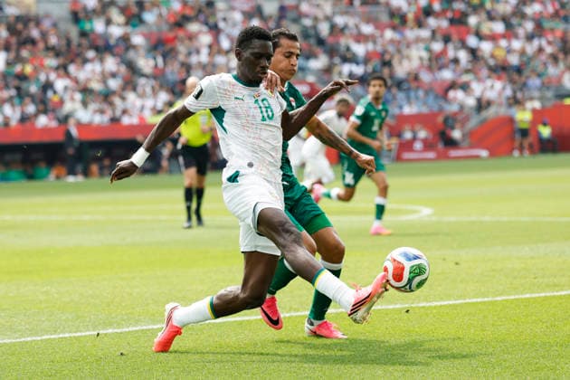 Ismaila Sarr (L) of Senegal vies for the ball with Ibrahim Bayesh of Iraq in a Group I match of the 2026 FIFA World Cup, WM, Weltmeisterschaft, Fussball between Senegal and Iraq at BMO Field stadium in Toronto, Canada, 26 June 2026. FIFA World Cup 2026 - Group I - Senegal vs Iraq !ACHTUNG: NUR REDAKTIONELLE NUTZUNG!  Copyright: xBienvenidoxVelascox AMDEP7415 20260626-55020723611_1