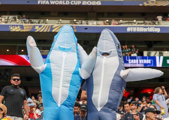 HOUSTON, TX - JUNE 26: Fans dressed in blowup shark costumes pose during the FIFA World Cup, WM, Weltmeisterschaft, Fussball 2026 Group H match between Cabo Verde and Saudi Arabia on June 26, 2026 at Houston Stadium in Houston, Texas. (Photo by Leslie Plaza Johnson Icon Sportswire) SOCCER: JUN 26 FIFA World Cup 26 Group H - Cabo Verde vs Saudi Arabia EDITORIAL USE ONLY Icon260626002