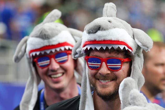 HOUSTON, TX - JUNE 26: Fans where Cabo Verde flag sunglasses and shark hats ahead of the FIFA World Cup, WM, Weltmeisterschaft, Fussball 2026 Group H match between Cabo Verde and Saudi Arabia on June 26, 2026, at Houston Stadium in Houston, Texas. (Photo by David Buono Icon Sportswire). SOCCER: JUN 26 FIFA World Cup 26 Group H - Cabo Verde vs Saudi Arabia EDITORIAL USE ONLY Icon260626006