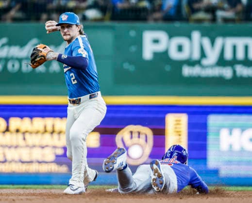 Milwaukee Brewers second baseman Brice Turang (L) forces out Chicago Cubs right fielder Matt Shaw (R) and turns a double play of Chicago Cubs shortstop Dansby Swanson in the third inning of the MLB, Baseball Herren, USA game between the Chicago Cubs and the Milwaukee Brewers at American Family Field in Milwaukee, Wisconsin on Friday, June 26, 2026.  MIL202606268010 TANNENxMAURY