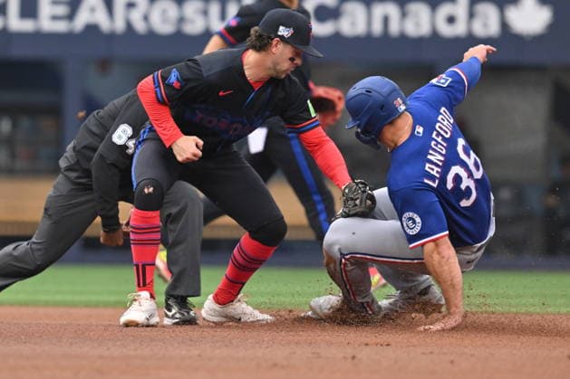 June 26, 2026, Toronto, On, Canada: Texas Rangers left fielder Wyatt Langford (36) slides into second base with a steal ahead of a tag by Toronto Blue Jays infielder Ernie Clement (22) during first inning MLB, Baseball Herren, USA baseball action in Toronto on Friday June 26, 2026. Canada News - June 26, 2026  - ZUMAc35_ 20260626_zaf_c35_250 Copyright: xJonxBlackerx