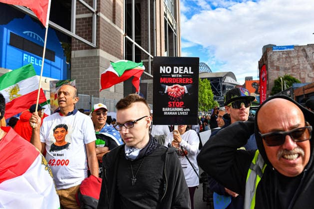 June 26, 2026: Iranian anti-regime protesters march with signs outside Seattle Stadium before the FIFA World Cup, WM, Weltmeisterschaft, Fussball match between Egypt and Iran in Seattle, WA. CSM Seattle United States - ZUMAc04_ 20260626_zma_c04_271 Copyright: xStevexFaberx