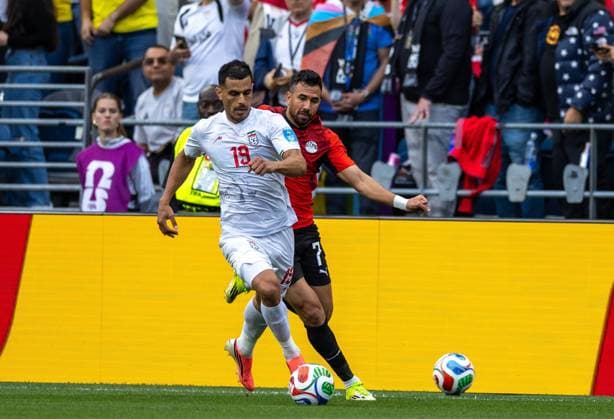 Egypt v Iran - FIFA World Cup, WM, Weltmeisterschaft, Fussball 2026 - Group G SEATTLE, USA - JUNE 26: Trezeguet (7) of Egypt in action against Ali Nemati (19) of Iran during the 2026 FIFA World Cup First Stage Group G match between Egypt and IR Iran at Lumen Field (Seattle Stadium) in Seattle, Washington, United States on June 26, 2026. Samah Zidan Anadolu Washington United States. Editorial use only. Please get in touch for any other usage.  Copyright: x2026xAnadoluxSamahxZidanx