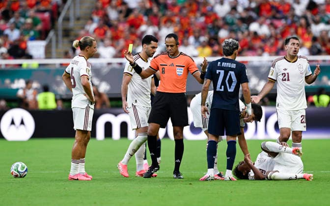 (260627) -- GUADALAJARA, June 27, 2026 -- Referee Ismail Elfath (C) gestures after showing a yellow card during the group H match between Uruguay and Spain at the 2026 FIFA World Cup, WM, Weltmeisterschaft, Fussball at Guadalajara Stadium in Guadalajara, Mexico, June 26, 2026. ) (SP)MEXICO-GUADALAJARA-FOOTBALL-FIFA WORLD CUP-GROUP H-URU VS ESP LixMuzi 