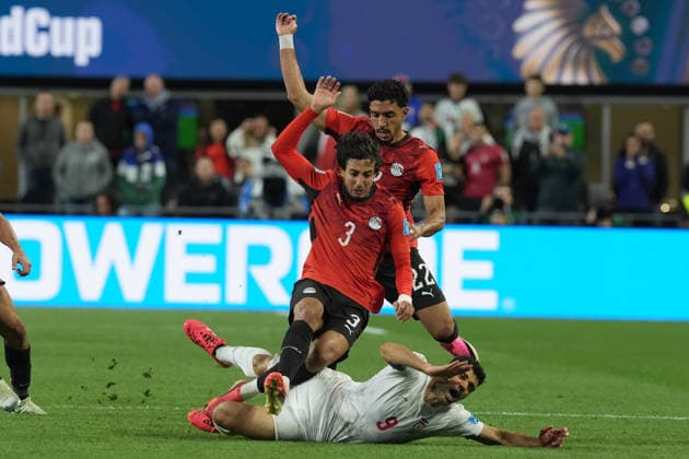 Mohamed Hany (C) and Omar Marmoush (C-back) of Egypt vies for the ball with Mehdi Taremi (below) of Iran during a Group G match at the 2026 FIFA World Cup, WM, Weltmeisterschaft, Fussball between Egypt and Iran at Lumen Field in Seattle, United States, 26 June 2026. FIFA World Cup 2026 - Group G - Egypt vs Iran !ACHTUNG: NUR REDAKTIONELLE NUTZUNG!  Copyright: xOmarxAlonsox AME5094 20260627-55020725185_1