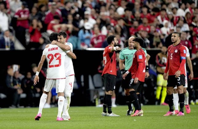 FIFA World Cup, WM, Weltmeisterschaft, Fussball 2026 - Group G - Egypt vs Iran Shojae Khalilzadeh (facing) and Ramin Rezaeian of Iran celebrate at the end of the FIFA World Cup 2026 group stage match Egypt against Iran, in Seattle, USA, 26 June 2026. The match ended 1-1. SEATTLE United States  Copyright: xSTEPHENxBRASHEARx
