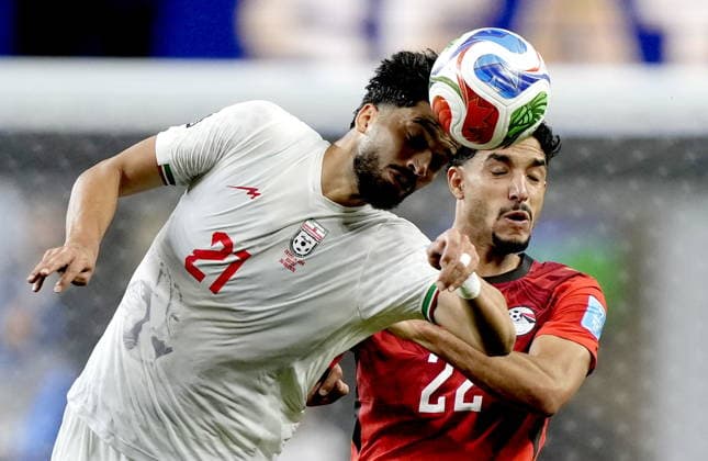 FIFA World Cup, WM, Weltmeisterschaft, Fussball 2026 - Group G - Egypt vs Iran Omar Marmoush (R) of Egypt and Mohammad Ghorbani of Iran in action during the FIFA World Cup 2026 group stage match Egypt against Iran, in Seattle, USA, 26 June 2026. SEATTLE United States  Copyright: xSTEPHENxBRASHEARx
