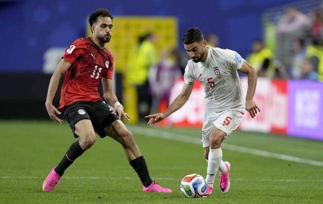 FIFA World Cup, WM, Weltmeisterschaft, Fussball 2026 - Group G - Egypt vs Iran Mostafa Ziko (L) of Egypt and Milad Mohammadi of Iran in action during the FIFA World Cup 2026 group stage match Egypt against Iran, in Seattle, USA, 26 June 2026. SEATTLE United States  Copyright: xSTEPHENxBRASHEARx