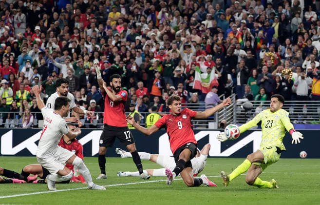 (260627) -- SEATTLE, June 27, 2026 -- Shoja Khalilzadeh (L, front) of Iran shoots during the group G match between Egypt and Iran at the 2026 FIFA World Cup, WM, Weltmeisterschaft, Fussball at Seattle Stadium in Seattle, the United States, June 26, 2026. (Photo by Xinhua) (SP)U.S.-SEATTLE-FOOTBALL-FIFA WORLD CUP-GROUP G-EGY VS IRN ArthurxDong 