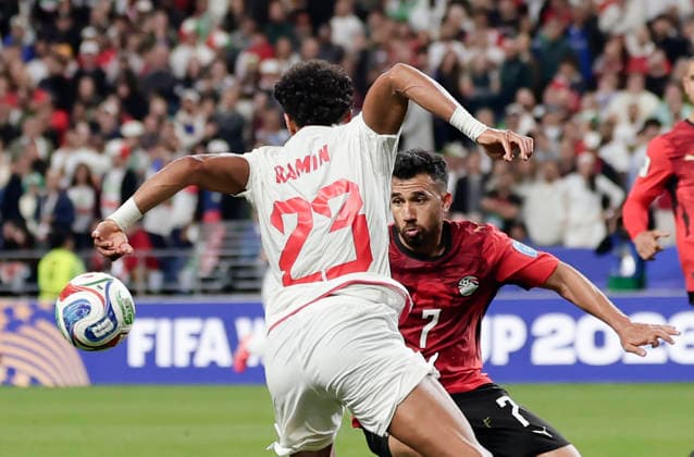 (260627) -- SEATTLE, June 27, 2026 -- Ramin Rezaeian (front) of Iran vies with Mahmoud Trezeguet of Egypt during the group G match between Egypt and Iran at the 2026 FIFA World Cup, WM, Weltmeisterschaft, Fussball at Seattle Stadium in Seattle, the United States, June 26, 2026. (Photo by Xinhua) (SP)U.S.-SEATTLE-FOOTBALL-FIFA WORLD CUP-GROUP G-EGY VS IRN ArthurxDong 