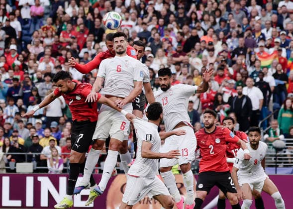 (260627) -- SEATTLE, June 27, 2026 -- Saeid Ezatolahi (front, top) of Iran jumps for a header during the group G match between Egypt and Iran at the 2026 FIFA World Cup, WM, Weltmeisterschaft, Fussball at Seattle Stadium in Seattle, the United States, June 26, 2026. (Photo by Xinhua) (SP)U.S.-SEATTLE-FOOTBALL-FIFA WORLD CUP-GROUP G-EGY VS IRN ArthurxDong 
