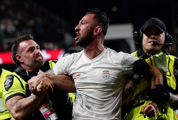 (260627) -- SEATTLE, June 27, 2026 -- A pitch invader (C) is seen removed from the field by security personnel during the group G match between Egypt and Iran at the 2026 FIFA World Cup, WM, Weltmeisterschaft, Fussball at Seattle Stadium in Seattle, the United States, June 26, 2026. (Photo by Xinhua) (SP)U.S.-SEATTLE-FOOTBALL-FIFA WORLD CUP-GROUP G-EGY VS IRN ArthurxDong 