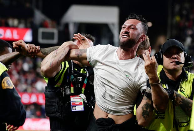 (260627) -- SEATTLE, June 27, 2026 -- A pitch invader (2nd R) is seen removed from the field by security personnel during the group G match between Egypt and Iran at the 2026 FIFA World Cup, WM, Weltmeisterschaft, Fussball at Seattle Stadium in Seattle, the United States, June 26, 2026. (Photo by Xinhua) (SP)U.S.-SEATTLE-FOOTBALL-FIFA WORLD CUP-GROUP G-EGY VS IRN ArthurxDong 