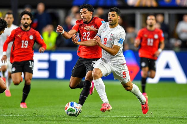 June 26, 2026: Iran forward Mehdi Taremi (9) and Egypt forward Omar Marmoush (22) compete for the ball during the FIFA World Cup, WM, Weltmeisterschaft, Fussball group stage match between Egypt and Iran in Seattle, WA. The match ended in a 1-1 draw. CSM Seattle United States - ZUMAc04_ 20260626_zma_c04_424 Copyright: xStevexFaberx