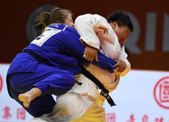 (260628) -- QINGDAO, June 28, 2026 -- Niu Xinran (R) of China competes against Helena Vukovic of Croatia during the women s +78kg bronze medal match at the IJF World Judo Tour Qingdao Grand Prix 2026 in Qingdao, east China s Shandong Province, June 28, 2026. ) (SP)CHINA-QINGDAO-JUDO-GRAND PRIX 2026(CN) LixZiheng 