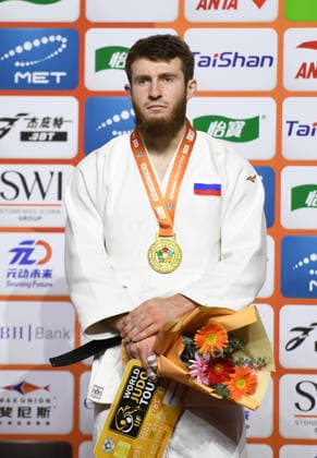 (260628) -- QINGDAO, June 28, 2026 -- Gold medalist Adam Sangariev of Russia poses during the awarding ceremony for the men s -100kg at the IJF World Judo Tour Qingdao Grand Prix 2026 in Qingdao, east China s Shandong Province, June 28, 2026. ) (SP)CHINA-QINGDAO-JUDO-GRAND PRIX 2026(CN) LixZiheng 