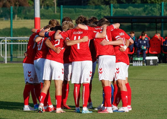 Denbighshire, Wales, 28th June 2026. Players of Denmark have a team huddle ahead of the Germany U19 vs Denmark U19 UEFA European U19 Championship match at Central Park, Denbighshire. Picture credit should read: Cody Froggatt Sportimage EDITORIAL USE ONLY. No use with unauthorised audio, video, data, fixture lists, club league logos or live services. Online in-match use limited to 120 images, no video emulation. No use in betting, games or single club league player publications. SPI_13_CF_GERMANY_U19_V_DENMARK_U19 SPI-4848-0013