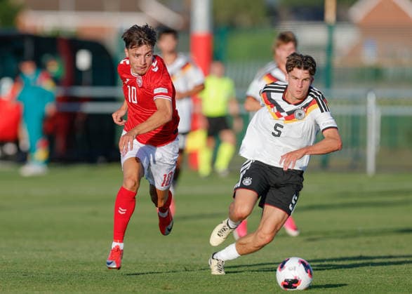 Denbighshire, Wales, 28th June 2026. Olti Hyseni of Denmark and Ben Nink of Germany chase down the ball during the Germany U19 vs Denmark U19 UEFA European U19 Championship match at Central Park, Denbighshire. Picture credit should read: Cody Froggatt Sportimage EDITORIAL USE ONLY. No use with unauthorised audio, video, data, fixture lists, club league logos or live services. Online in-match use limited to 120 images, no video emulation. No use in betting, games or single club league player publications. SPI_19_CF_GERMANY_U19_V_DENMARK_U19 SPI-4848-0019