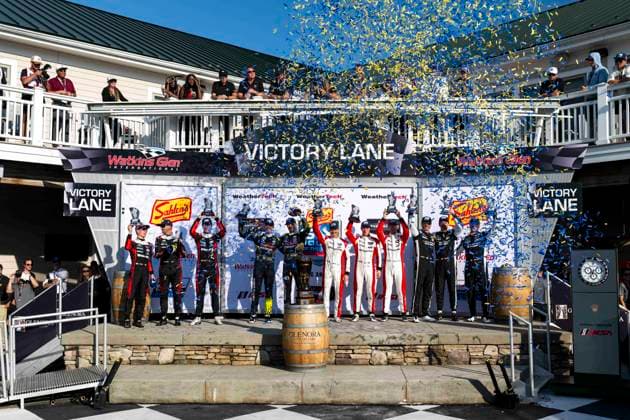 AUTO - 6 HOURS OF THE GLEN 2026 31 AITKEN Jack (gbr), BAMBER Earl (nzl), VESTI Frederik (dnk), Cadillac Whelen, Cadillac V-Series.R, 14 BARNICOAT Ben (gbr), HAWKSWORTH Jack (gbr), Vasser Sullivan Racing, Lexus RC F GT3, 04 KURTZ George (usa), QUINN Alex (gbr), SOWERY Toby (gbr), CrowdStrike Racing by APR, Oreca 07-Gibson, 912 HARDWICK Ryan (usa), PERA Riccardo (ita), SCHURING Morris (nld), Manthey 1st Phorm, Porsche 911 GT3 R (992.2), podium during the Six Hours of the Glen 2026, 6th round of the 2026 IMSA WeatherTech SportsCar Championship, from June 26 to 28 on the Watkins Glen International in Watkins Glen, New York, United States of America - Watkins GlenUnited States  Copyright: xFabrizioxBoldonix