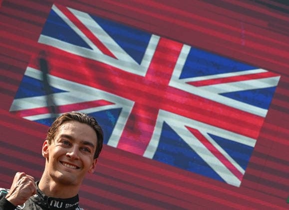 F1 Grand Prix Of Austria SPIELBERG, AUSTRIA - JUNE 28: Race winner George Russell of Great Britain and Mercedes-AMG celebrates on the podium in front of a digital screen displaying the British Union Jack flag during the trophy ceremony of the F1 Grand Prix of Austria at Red Bull Ring on June 28, 2026 in Spielberg, Austria. Spielberg Austria  Copyright: xArturxWidakx originalFilename:widak-f1grandp260628_npq8T.jpg