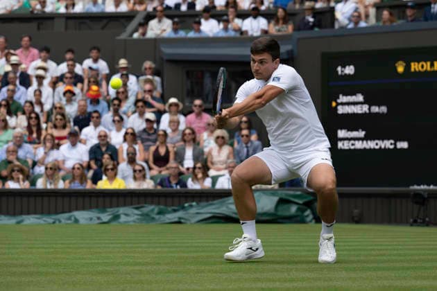 RECORD DATE NOT STATED 29th June 2026; All England Lawn Tennis and Croquet Club, London, England; Wimbledon Tennis Tournament, Day One; Miomir Kecmanovic (SRB) plays a backhand in his first round match against Jannik Sinner (ITA) GodfreyxPitt