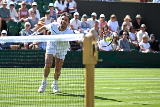RECORD DATE NOT STATED 29th June 2026; All England Lawn Tennis and Croquet Club, London, England; Wimbledon Tennis Tournament, Day One; Cameron Norrie (GBR) plays a volley in his first round match against Michael Zheng (USA) GodfreyxPitt