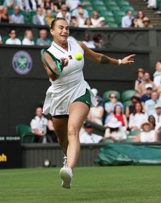 Aryna Sabalenka plays a forehand in her match against Serbian Teodora Kostovic on day one of the 2026 Wimbledon Championships in London on Monday, June 29, 2026.  LON2026062936 HUGOxPHILPOTT