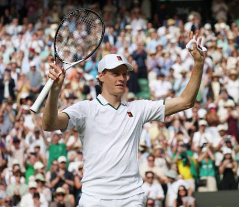 Italy s Jannik Sinner smiles after winning his match against Serbian Miomir Kecmanovic on day one of the 2026 Wimbledon Championships in London on Monday, June 29, 2026.  LON2026062944 HUGOxPHILPOTT